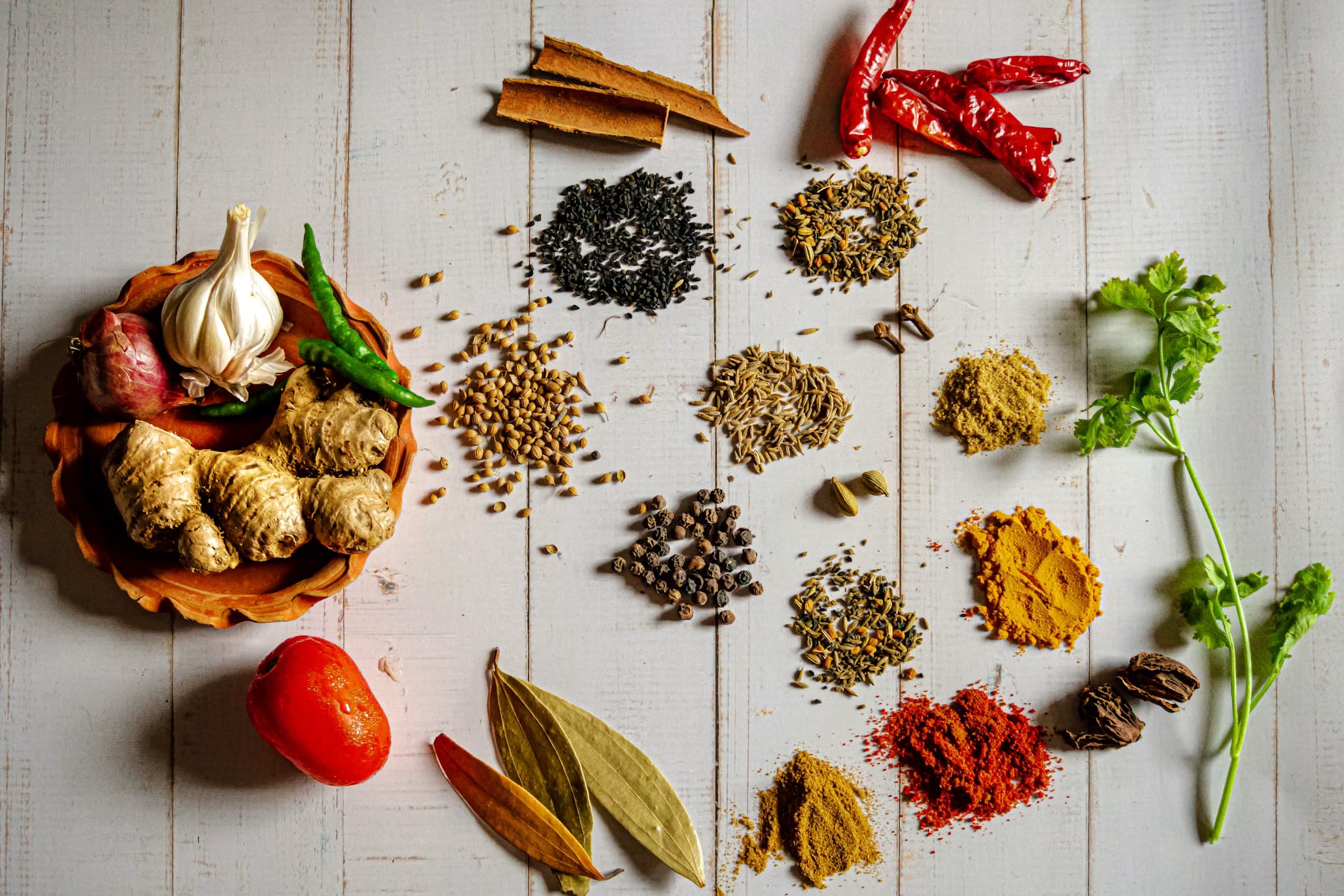 Artisanal Himalayan spices including turmeric and chilies